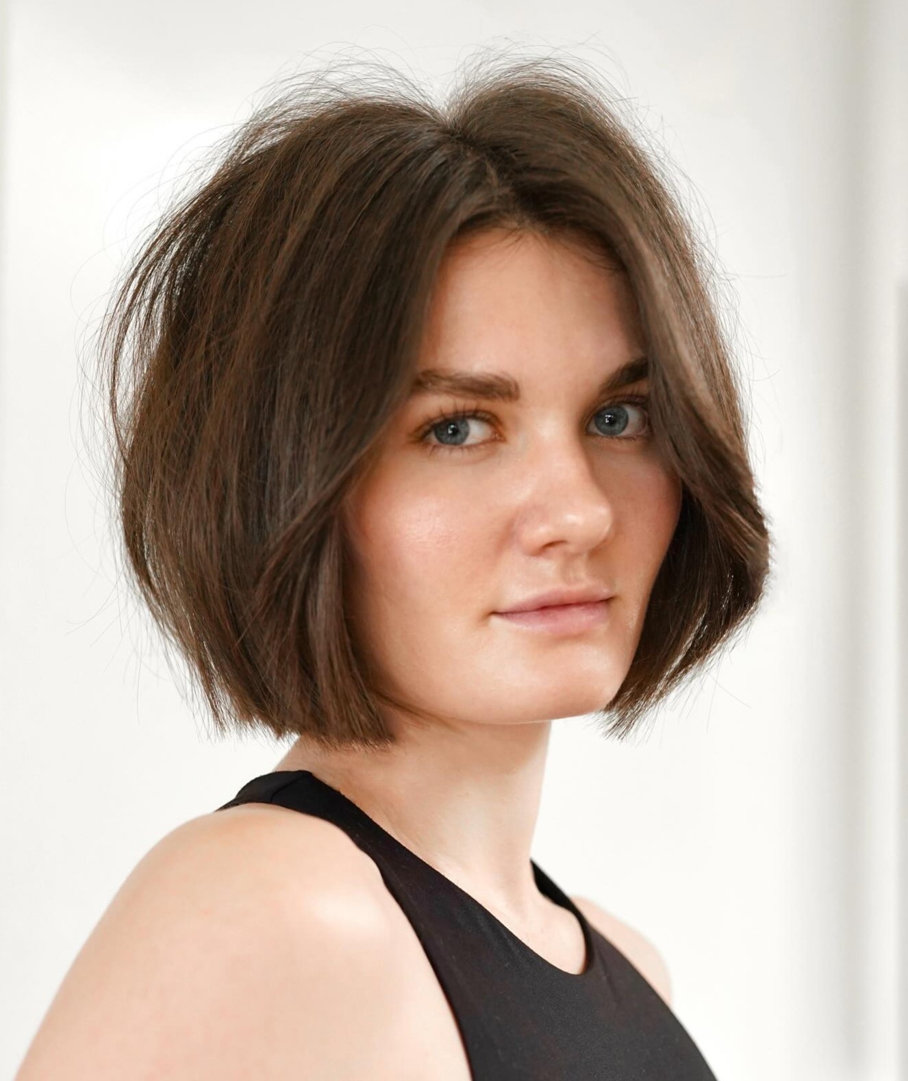 Asymmetrical Bob Haircut on a Woman with a Round Face Shape