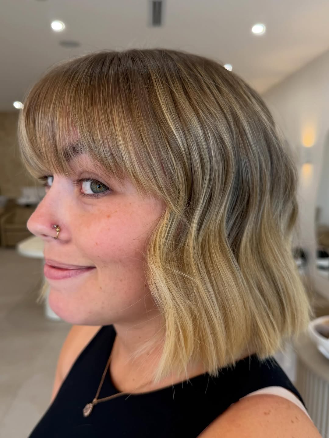 Wavy Blonde Blunt Bob Haircut with Bangs