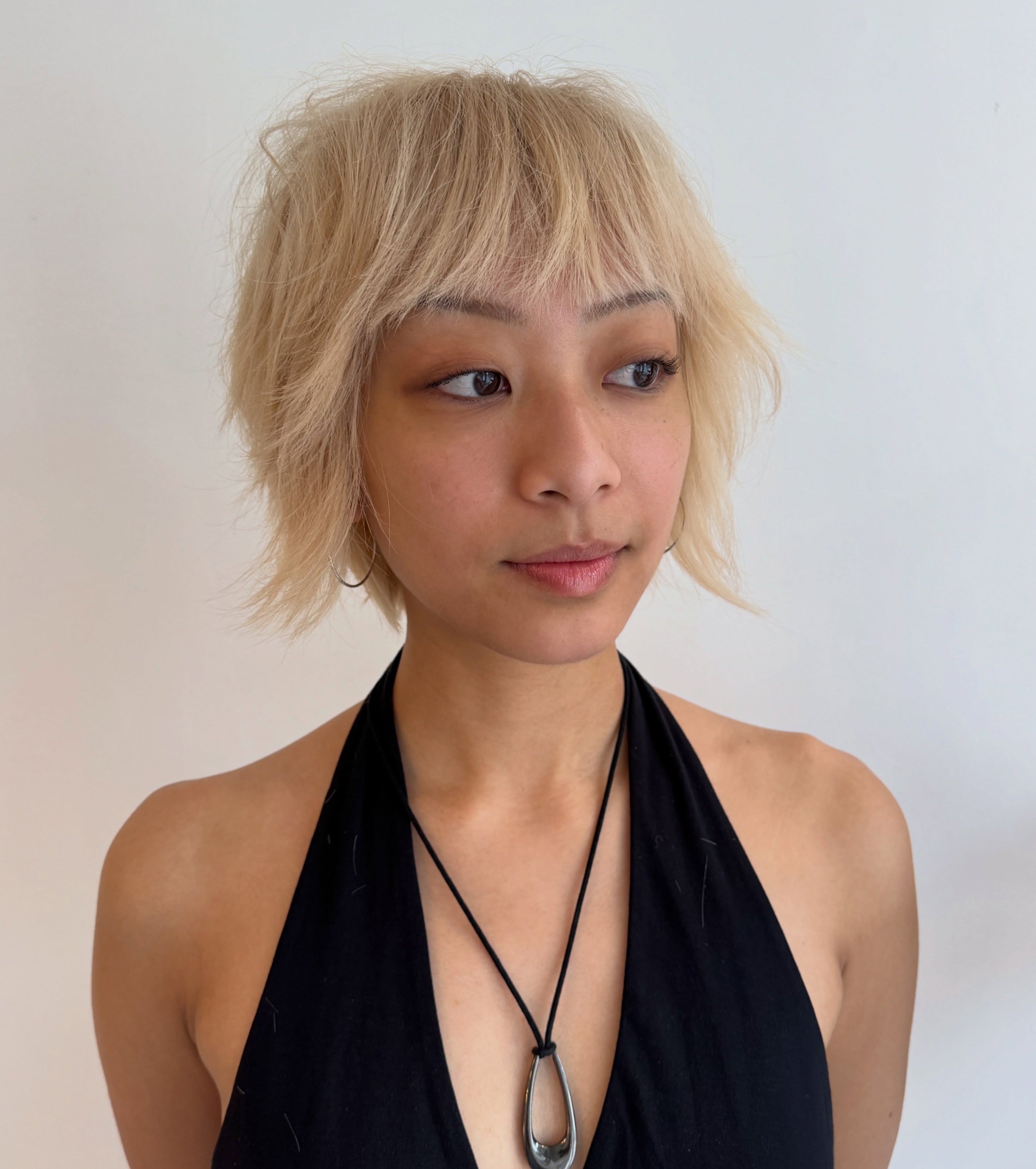 Choppy Shaggy Blonde Bob with Textured Layers for a Round Face