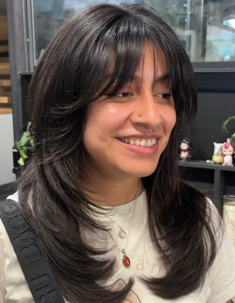 Shoulder-Length Dark Hair with Textured Layers for Round Face Shapes