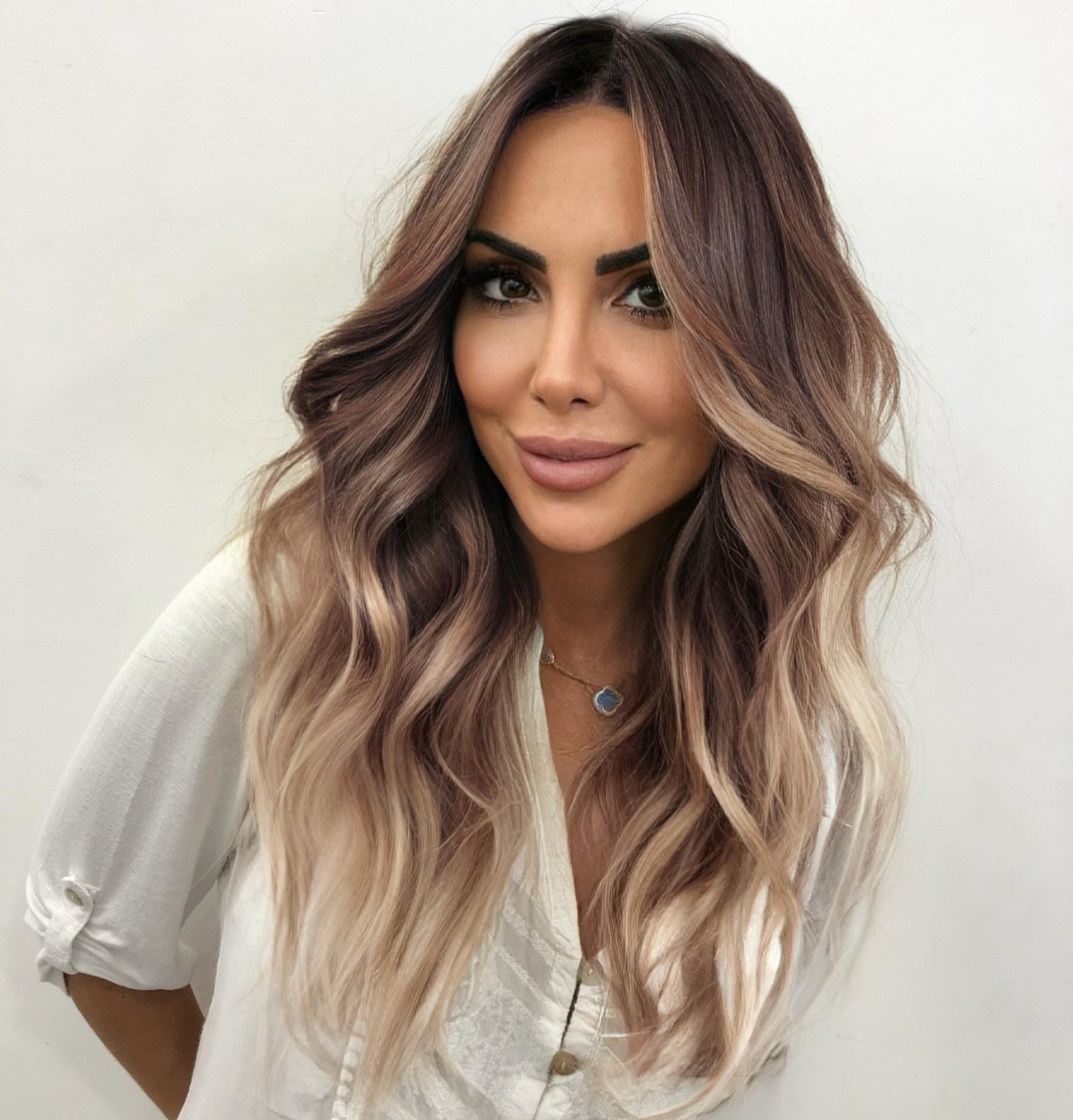 Long Wavy Hair with Soft Hand-Painted Balayage Highlights Explaining the Technique