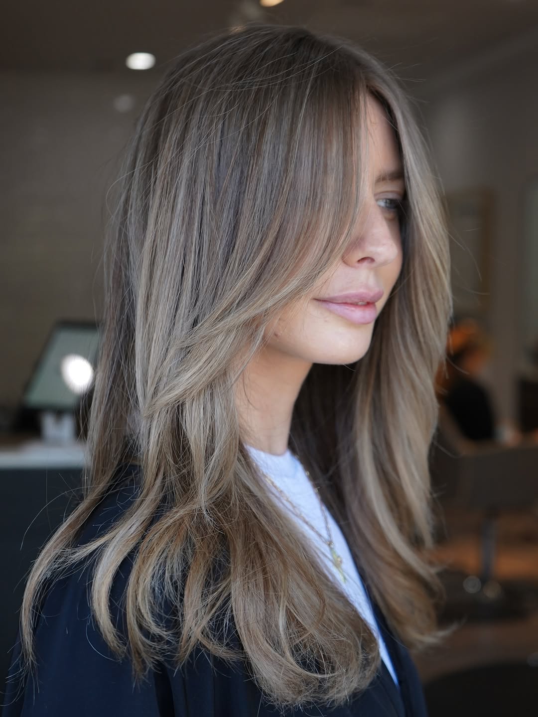 Smooth Ash Blonde Long Hair Illustrating Expert Cutting Techniques