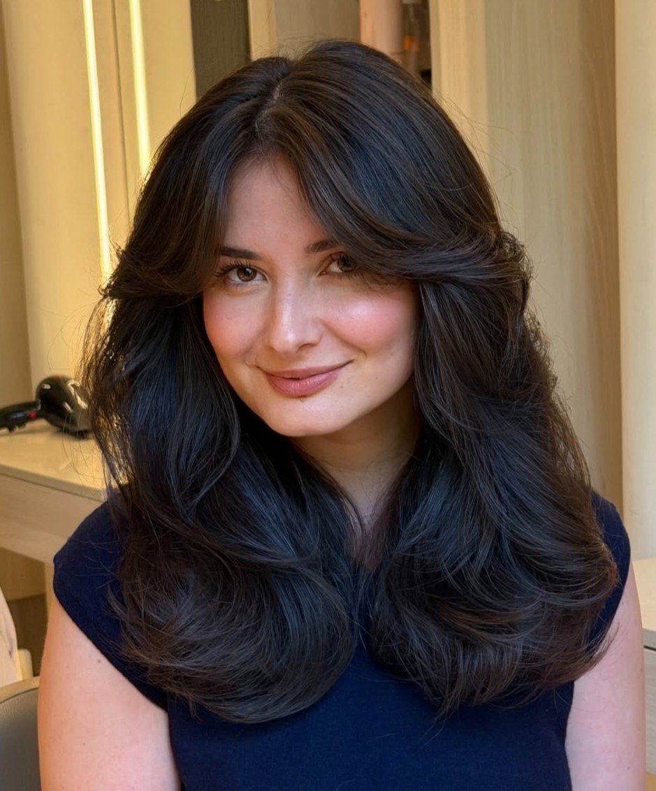Voluminous Dark Brown Blowout with Long Curtain Bangs