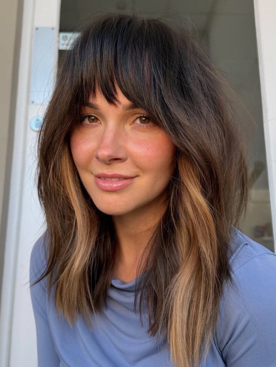 Textured Shaggy Bob with Choppy Bangs and Caramel Highlights