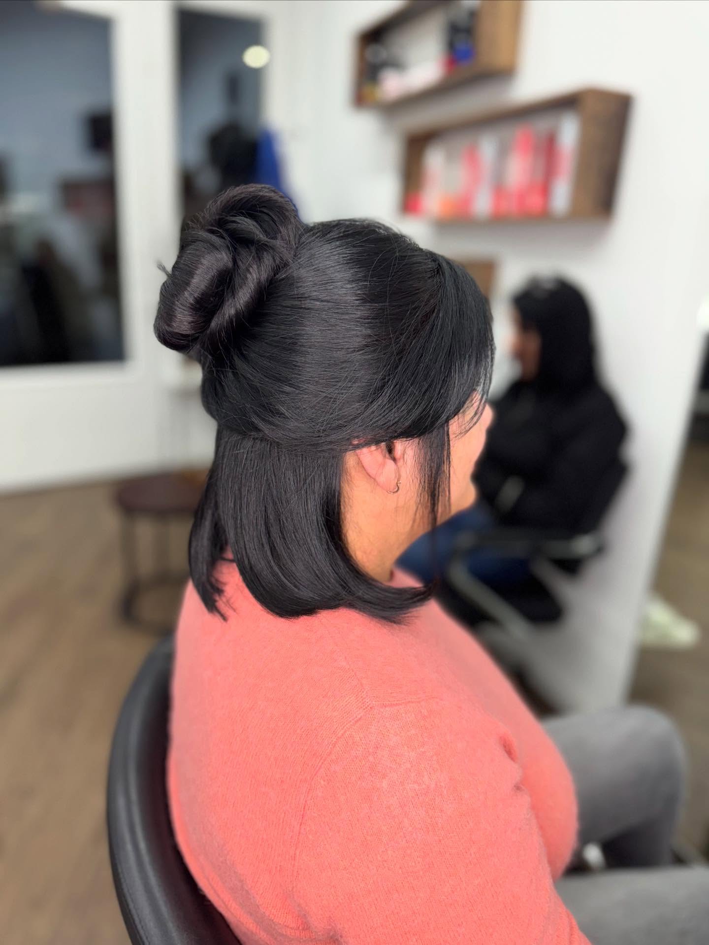 Sleek Jet Black Korean Bob with Top Half Tied in a Twisted Bun Side View
