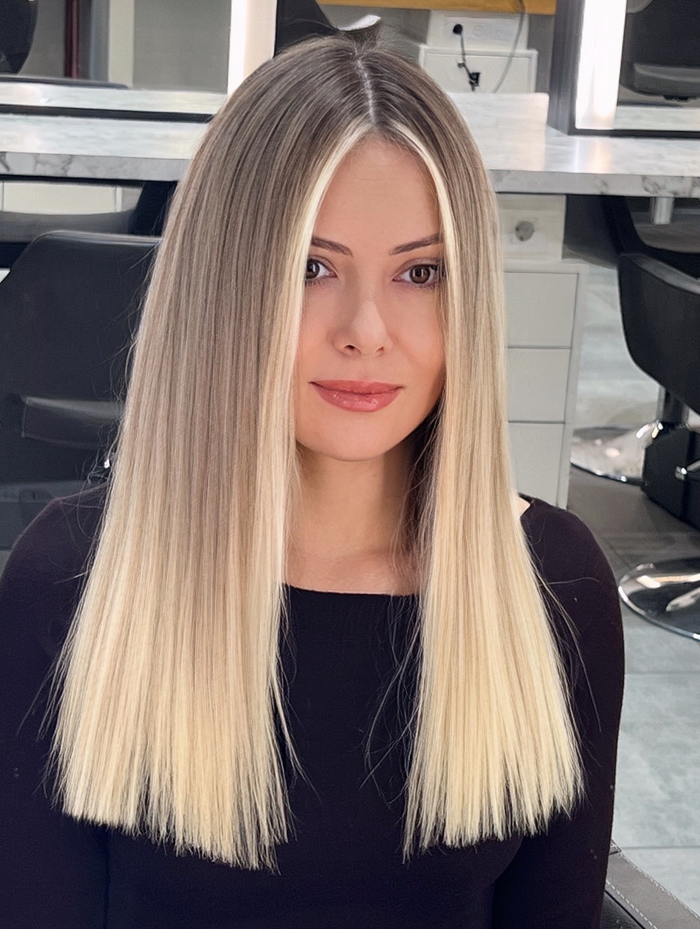 High-Contrast Blonde Money Piece Highlights on Straight Hair as a Related Technique