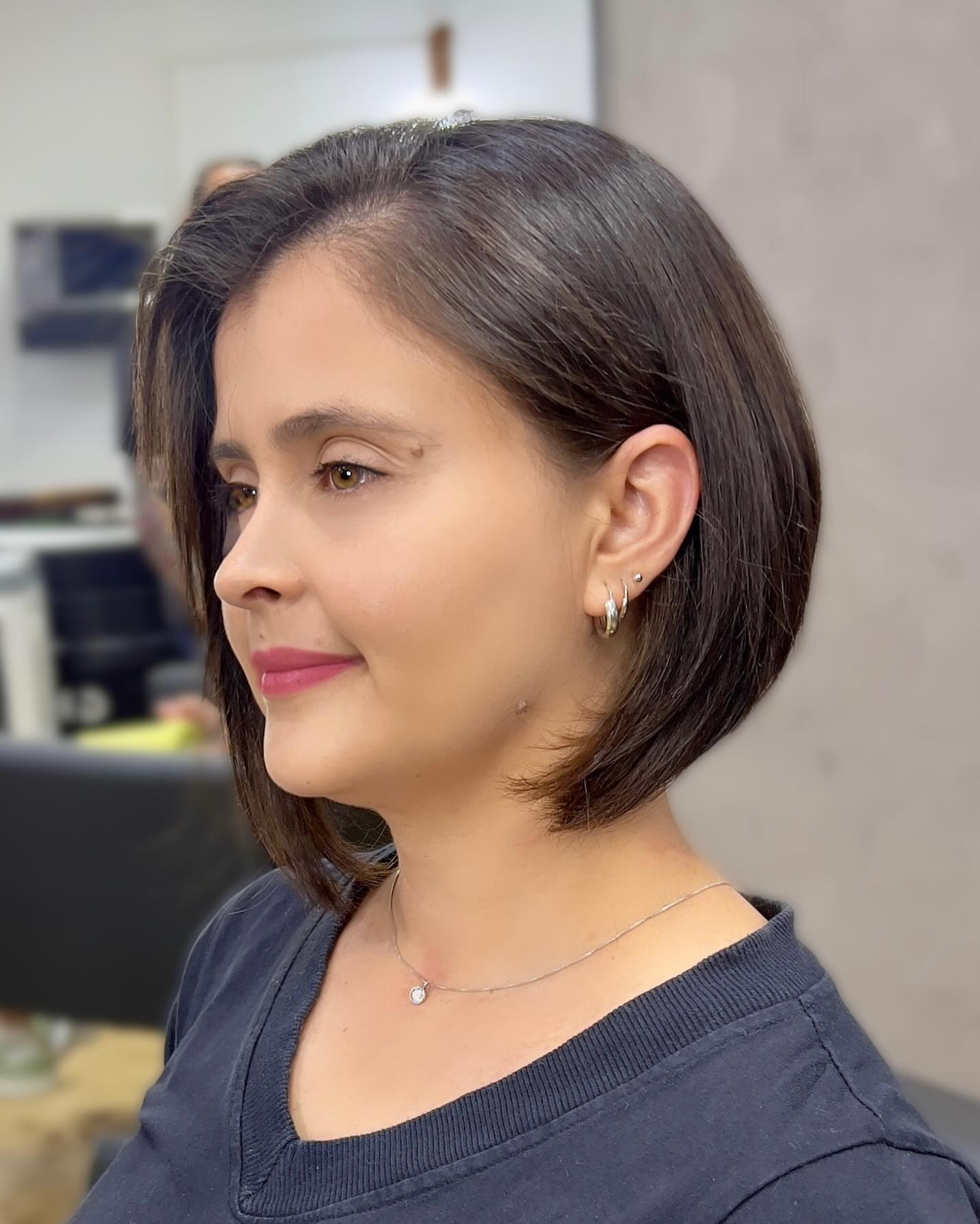Polished Side-Parted Bob on a Woman with a Round Face Shape