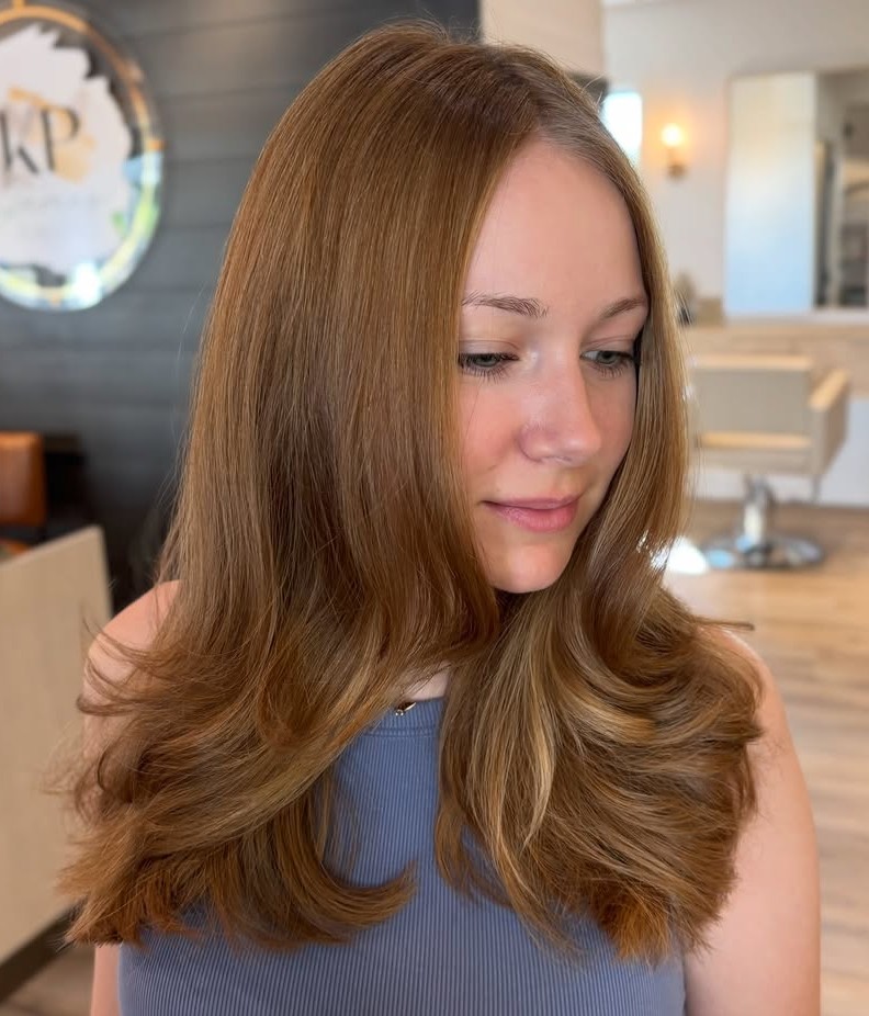 Side Profile of Very Long Sleek Blonde Layered Hair