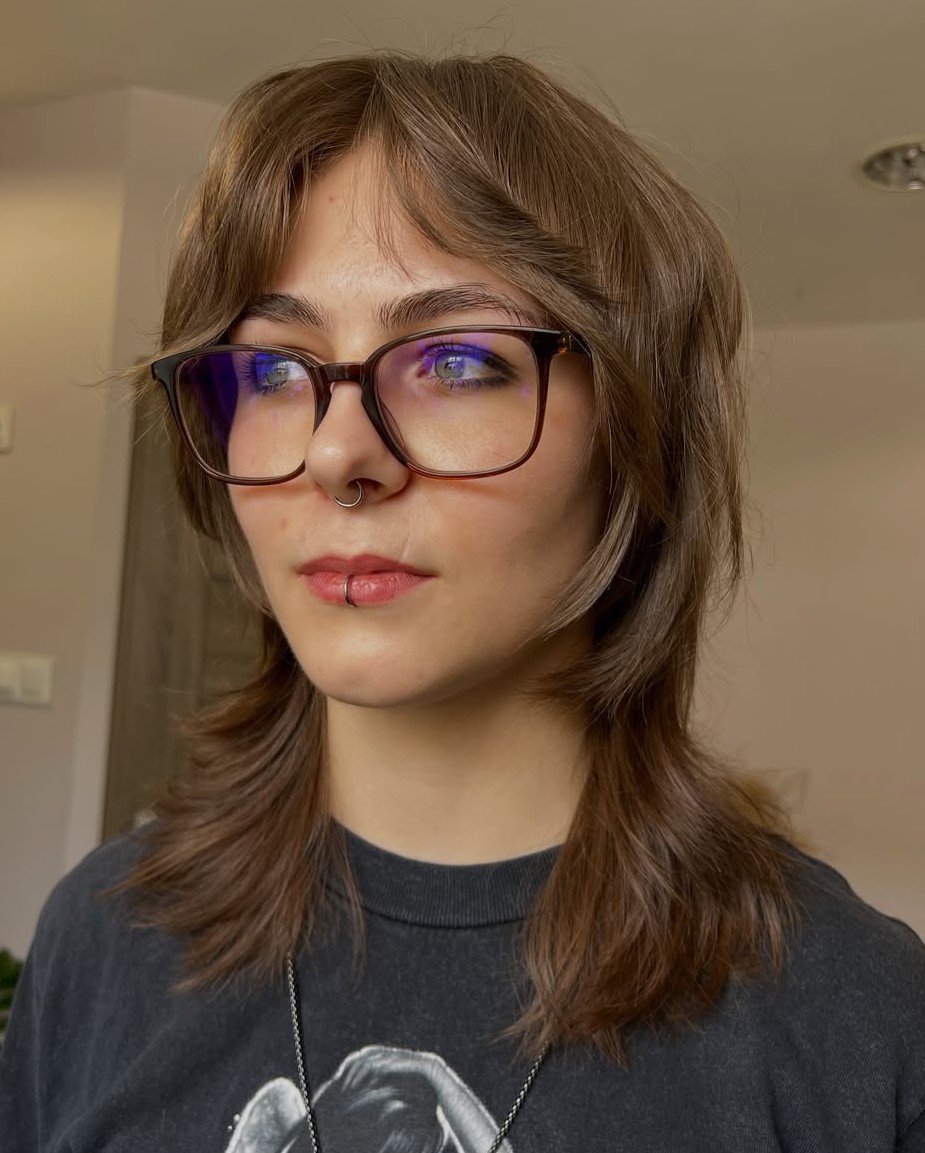Light Brown Layered Wolf Cut with Glasses and Curtain Bangs