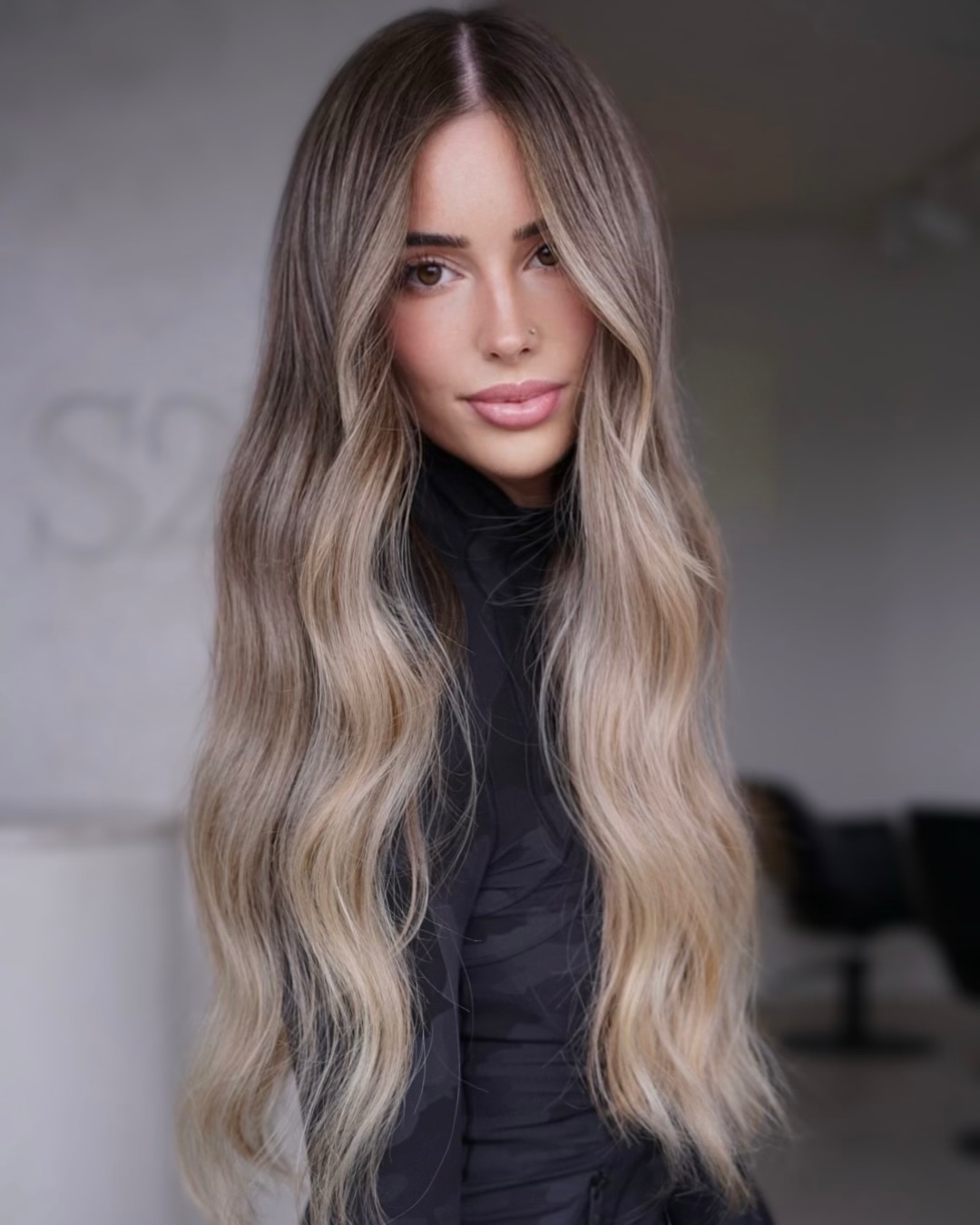 Ultra Long Wavy Blonde Balayage Hair showing High Maintenance Needs Between Visits