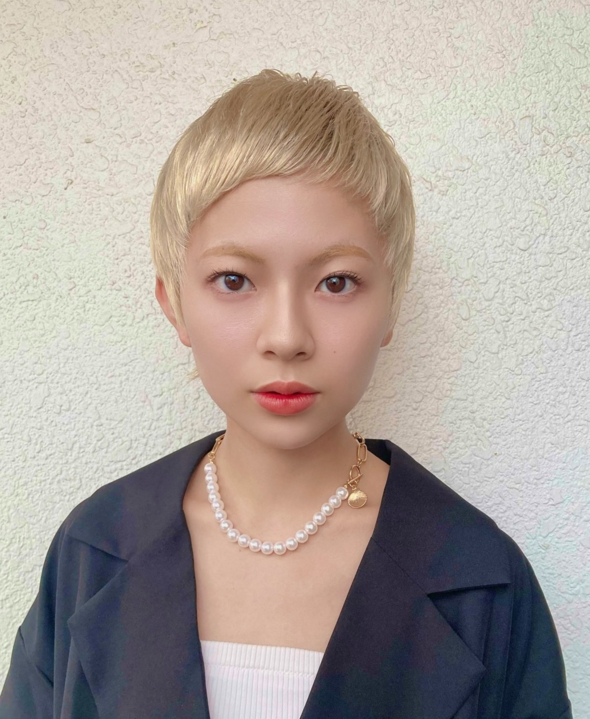 Sleek Platinum Blonde Classic Pixie Crop with Very Short Tapered Bangs