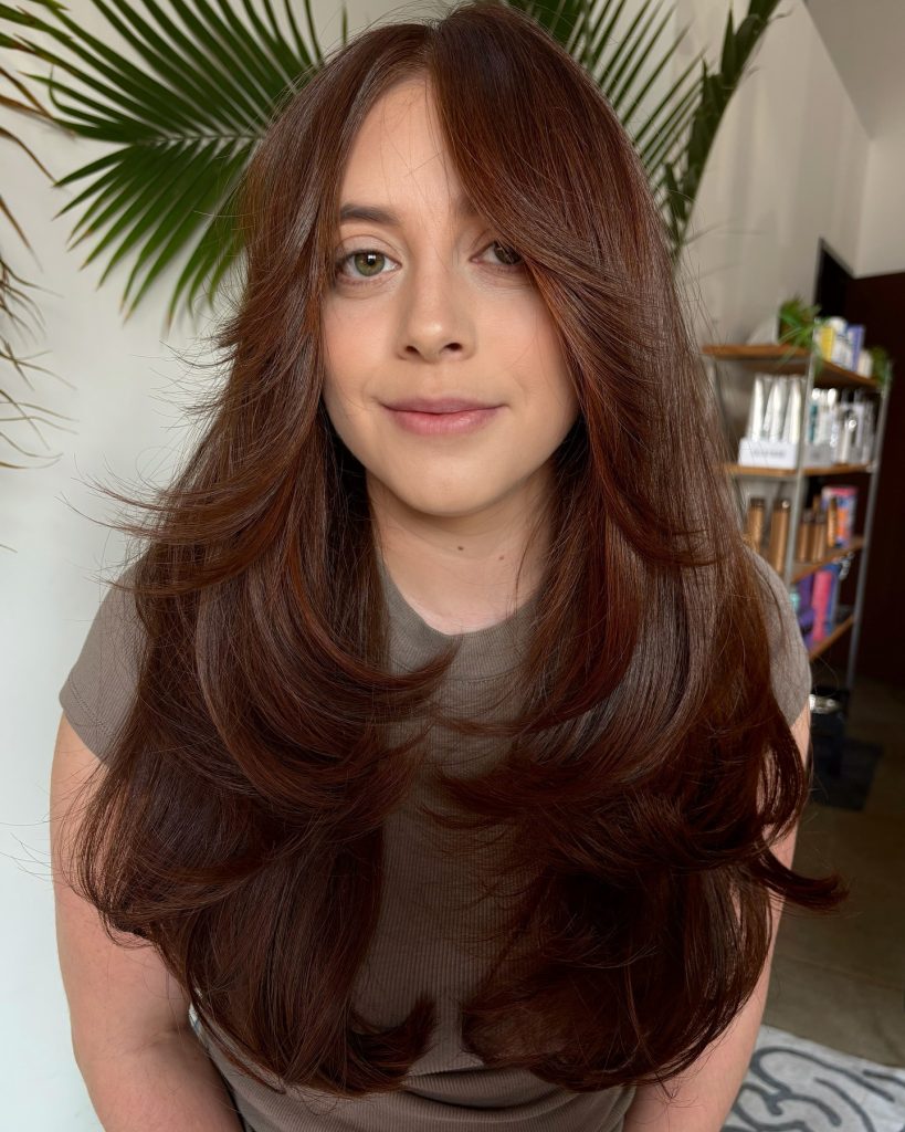 Long Butterfly Haircut with Soft Face-Framing Layers on Brown Hair