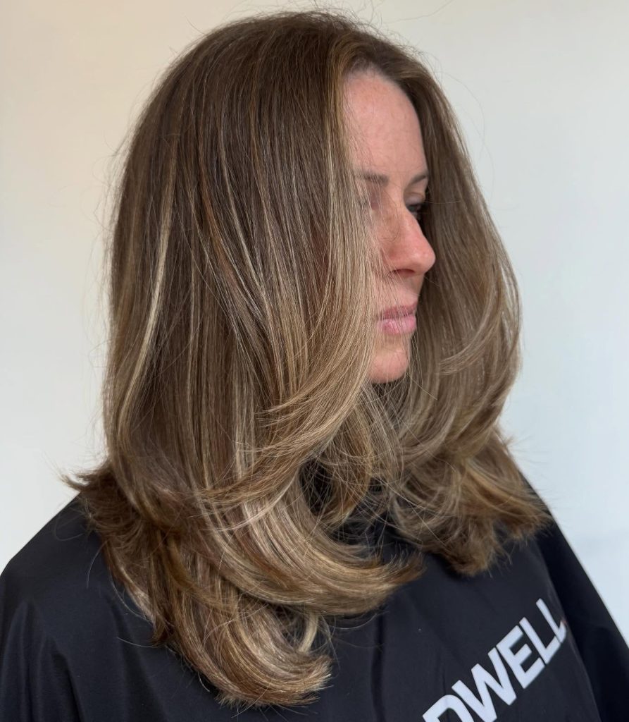 Shoulder-Length Layered Haircut with Soft Face-Framing Layers on Light Brown Hair