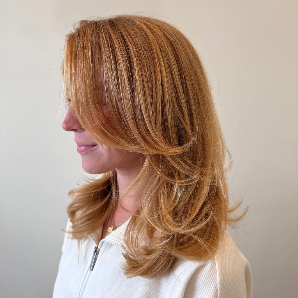 Medium Layered Haircut with Soft Face-Framing Layers on Shoulder-Length Hair