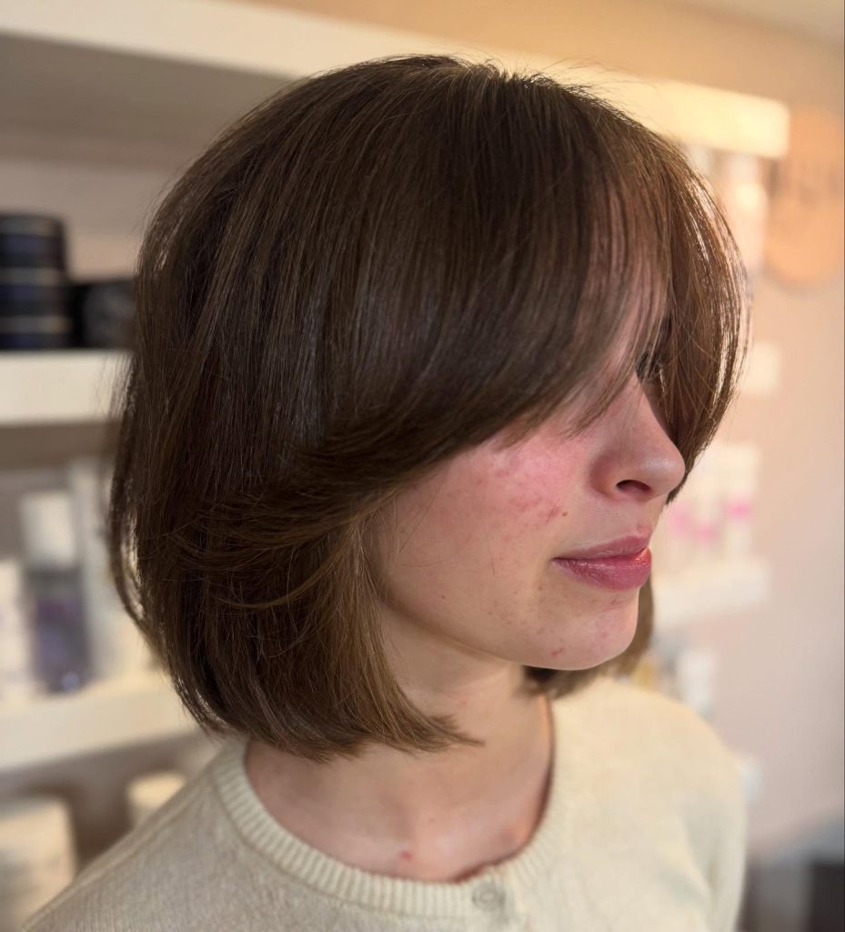 Short Layered Bob with Soft Curtain Bangs on Straight Hair