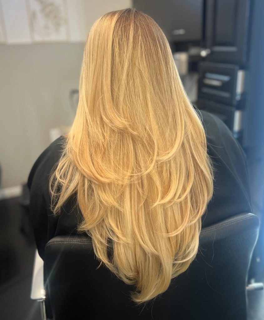 Long Layered Haircut on Straight Fine Hair Showing V-Shaped Graduation from the Back