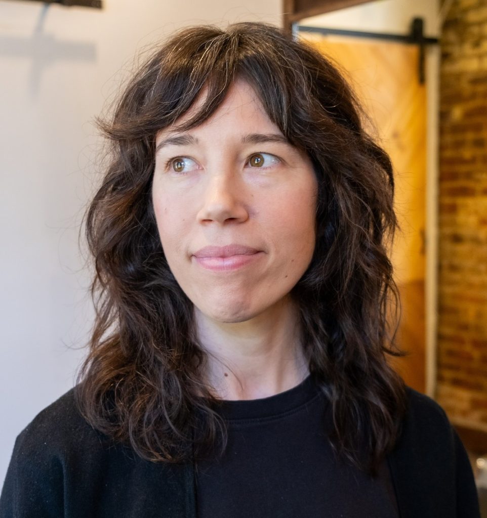 Medium Layered Haircut on Wavy Hair with Natural Texture and Tousled Movement