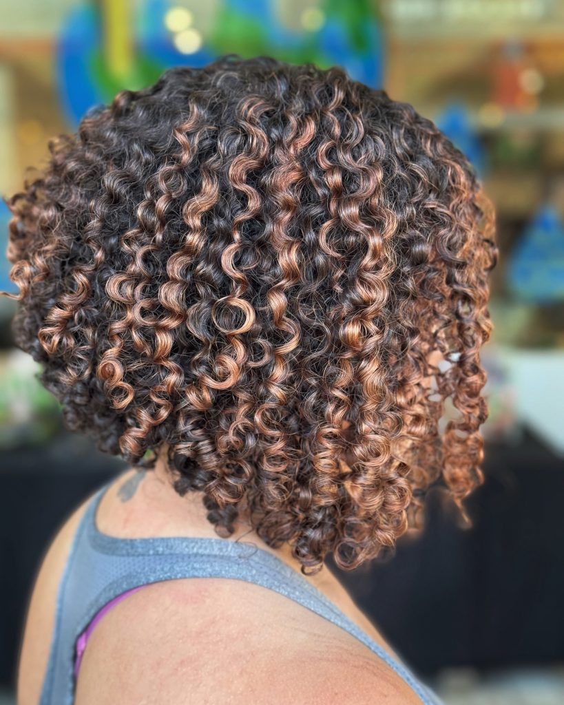 Curly Bob with Highlights and Balayage for Dimensional Hair Color