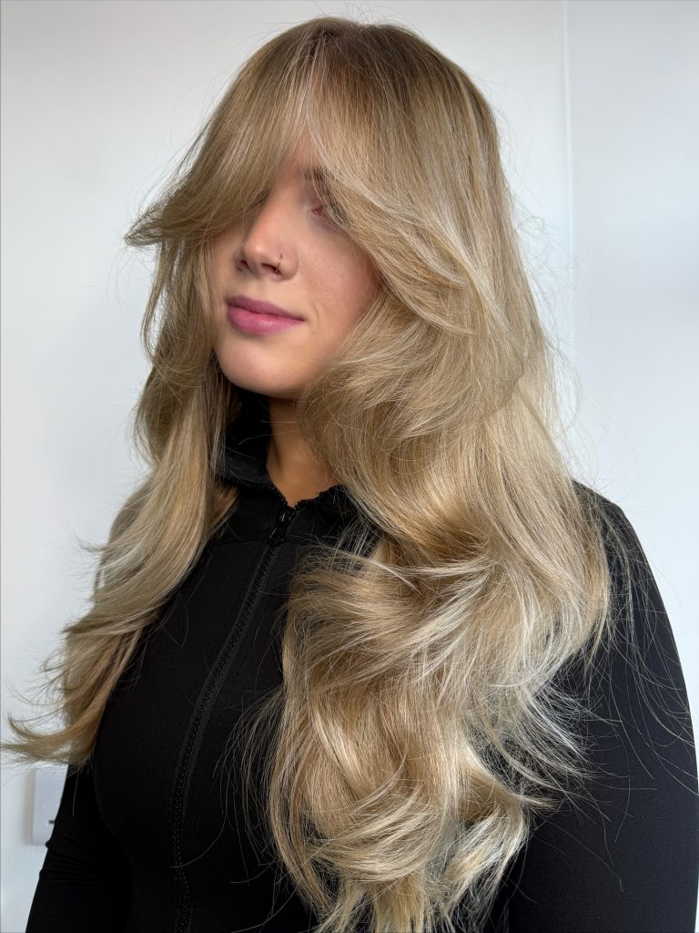 Textured Butterfly Haircut with Heavy Layering and Razored Ends on Thick Hair
