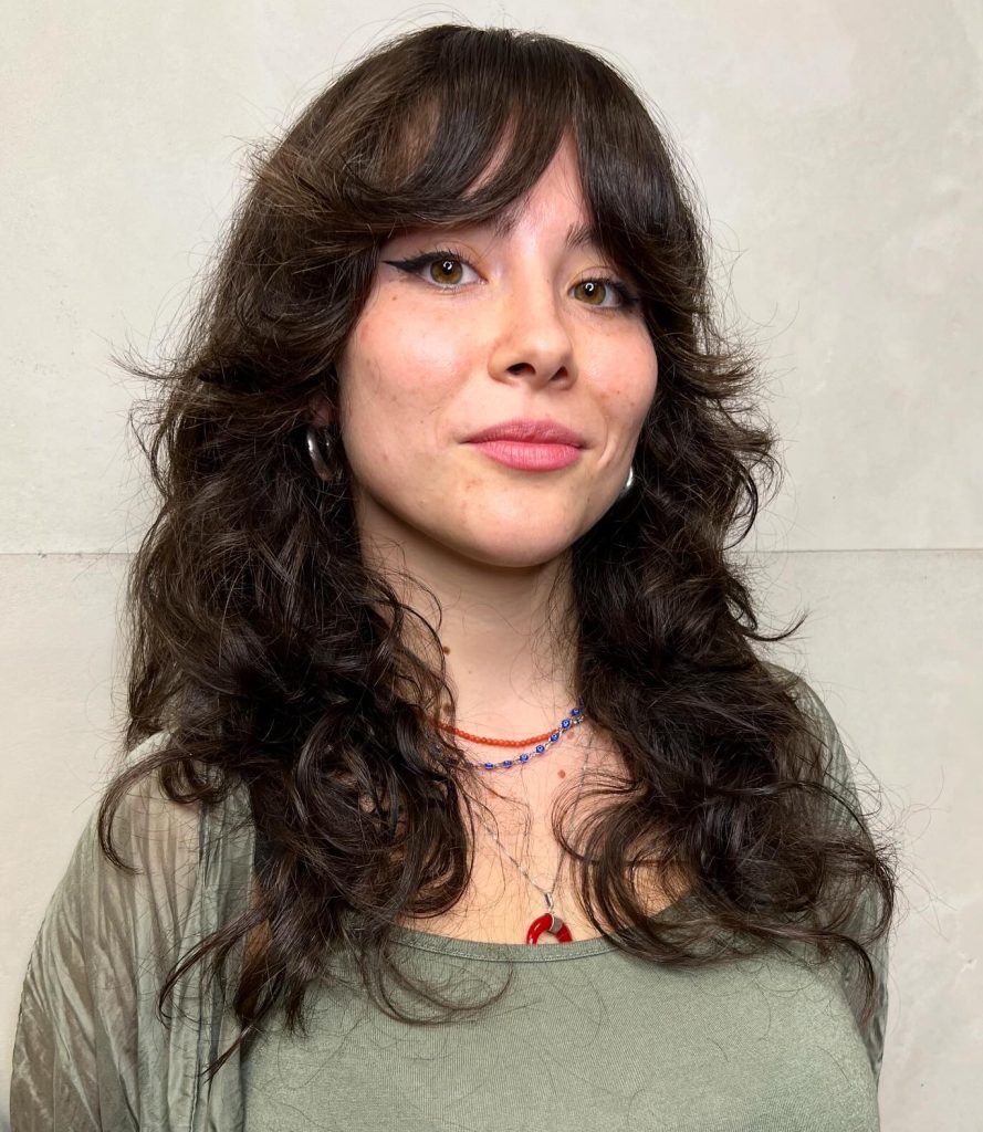 Curtain Bangs with Layers on Wavy Textured Hair Showing Natural Movement