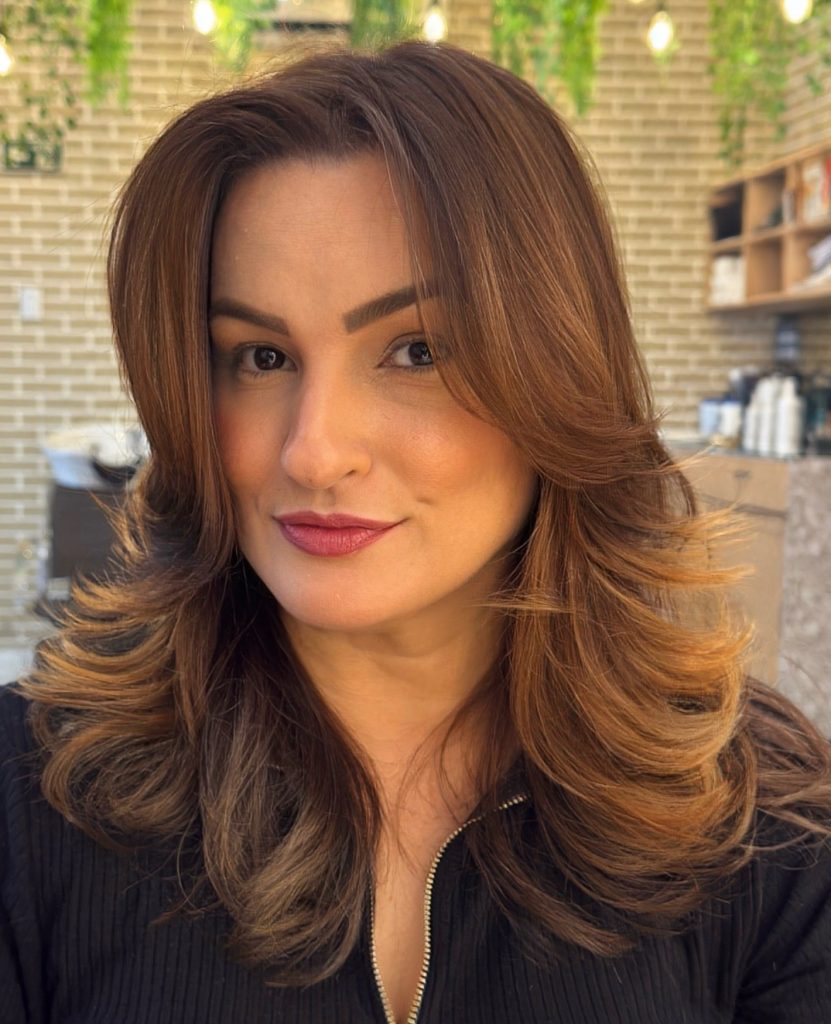 Long Layered Haircut with Curtain Bangs on Shoulder-Length Light Brown Hair