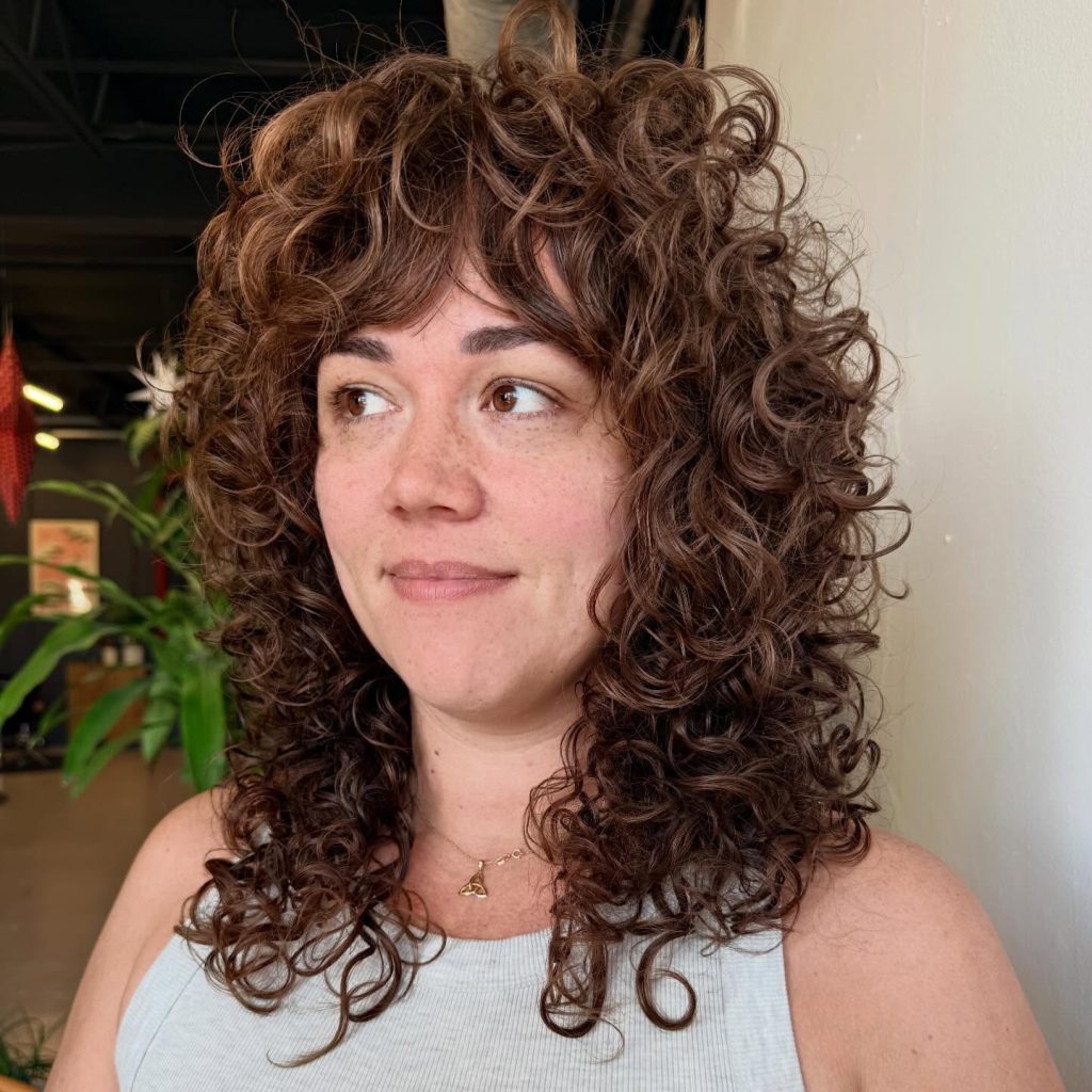 Textured Shag Haircut on Natural Curly Hair Showing Defined Layers and Volume