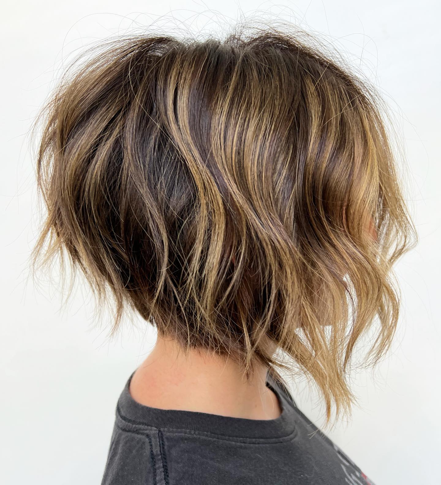 Textured Stacked Bob Haircut with Messy Layers and Extra Volume