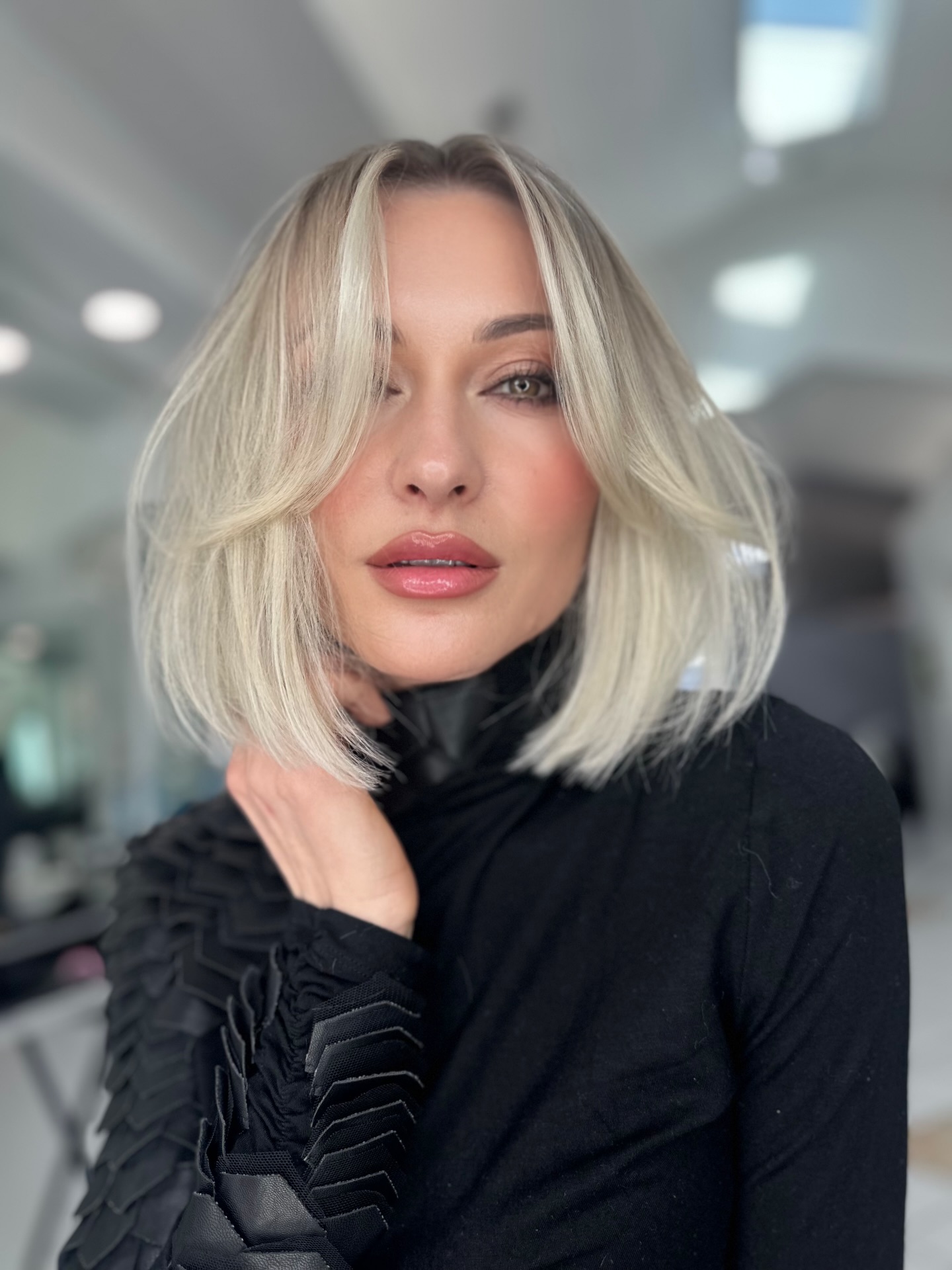 Chic Ash White Blonde Bob with Soft Curtain Framing Layers Front View
