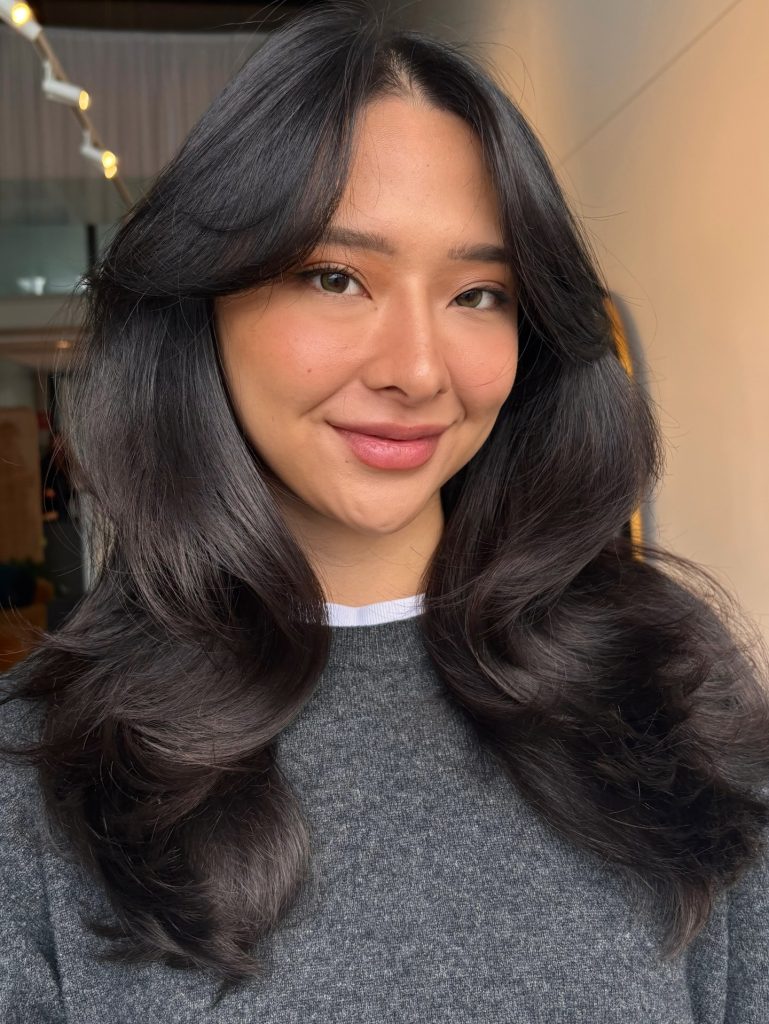 Blow-Drying Curtain Bangs with a Round Brush for the Signature Sweep Shape