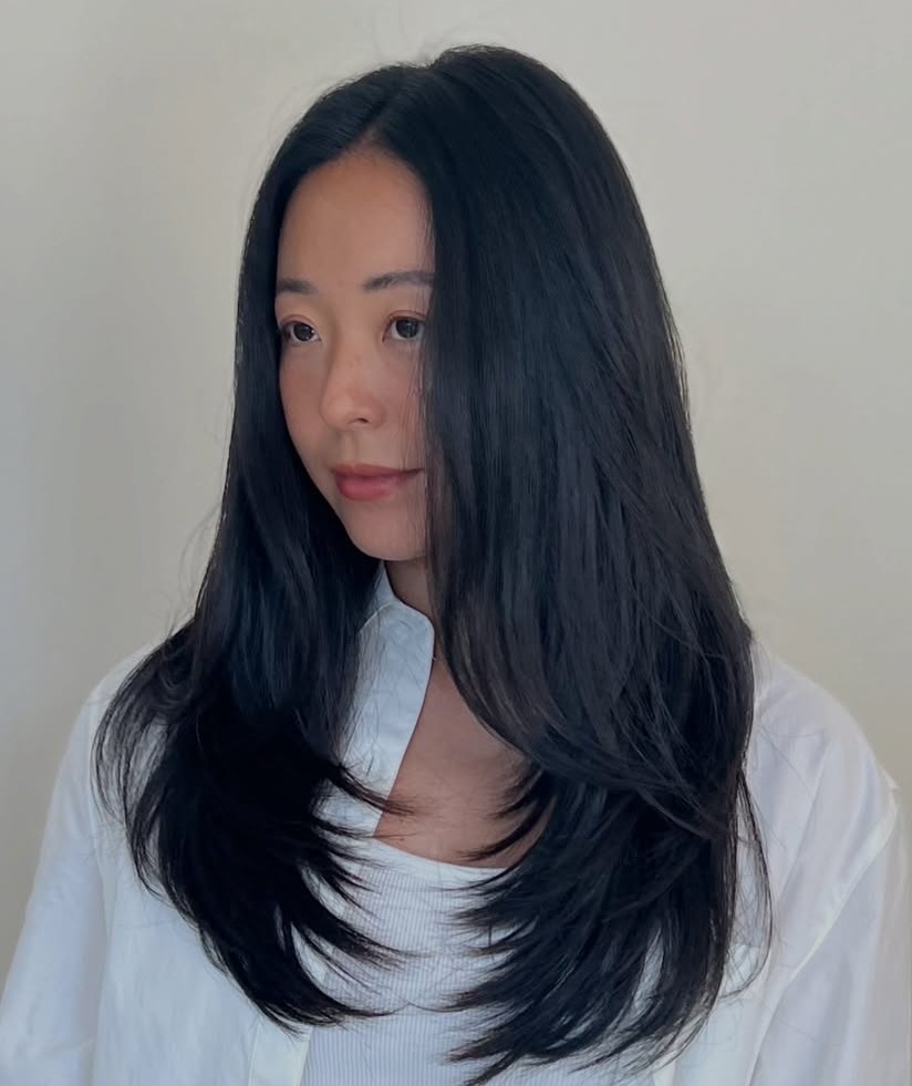 Long Jet Black Hair with Sleek Volumizing Layers and Face-Framing Strands