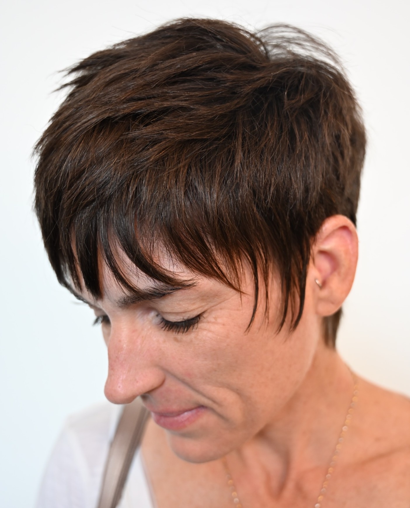 Textured Pixie Cut with Razored Layers with Movement and Dimension on Medium-Density Hair