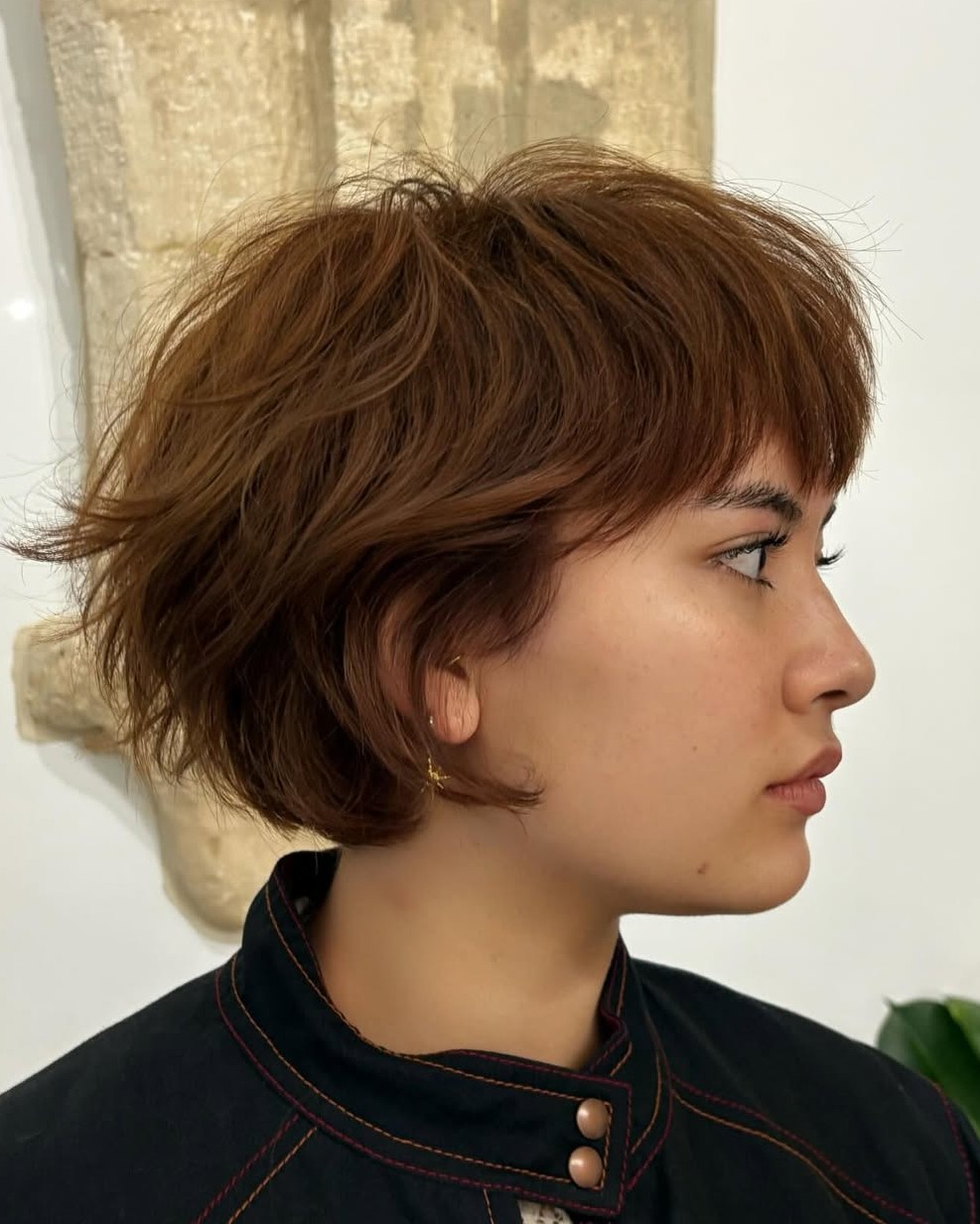 Short Messy Light Brown Bob with Choppy Layers and Eyebrow-Grazing Bangs