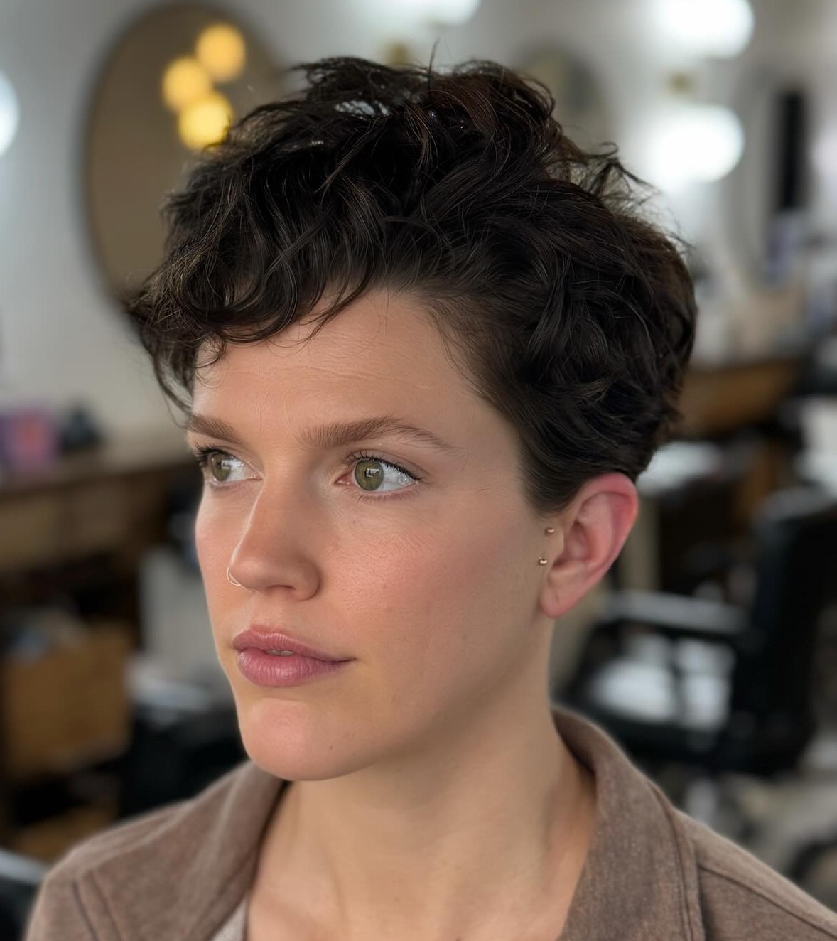 Tousled Wavy Pixie Cut on 2C Hair with Natural Texture and Tapered Sides