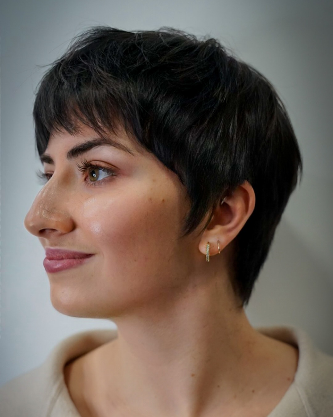Internally Thinned Layered Pixie on Thick Straight Hair Showing Controlled Volume and Tapered Sides