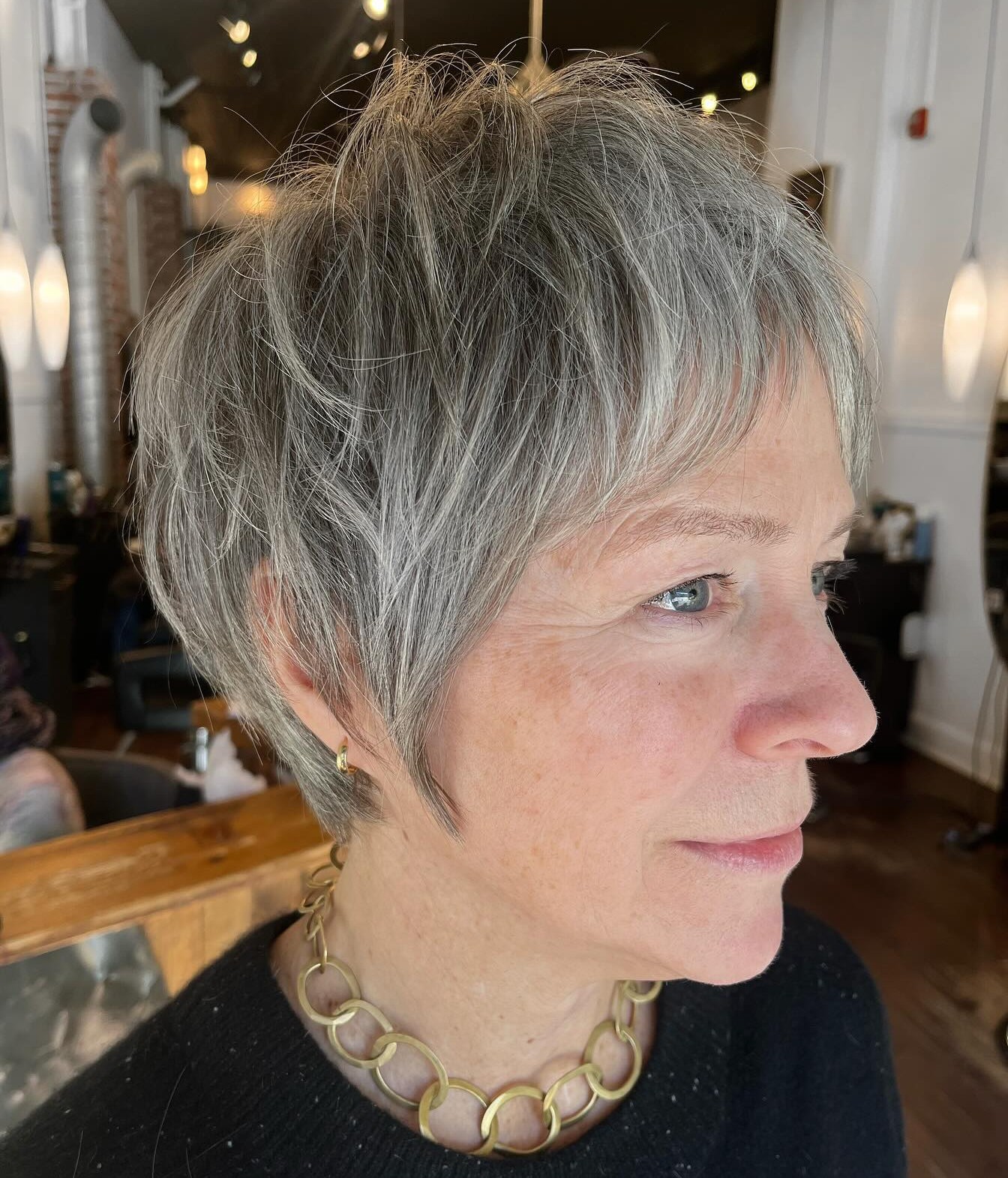 Side Profile of a Short Messy Grey Pixie Cut