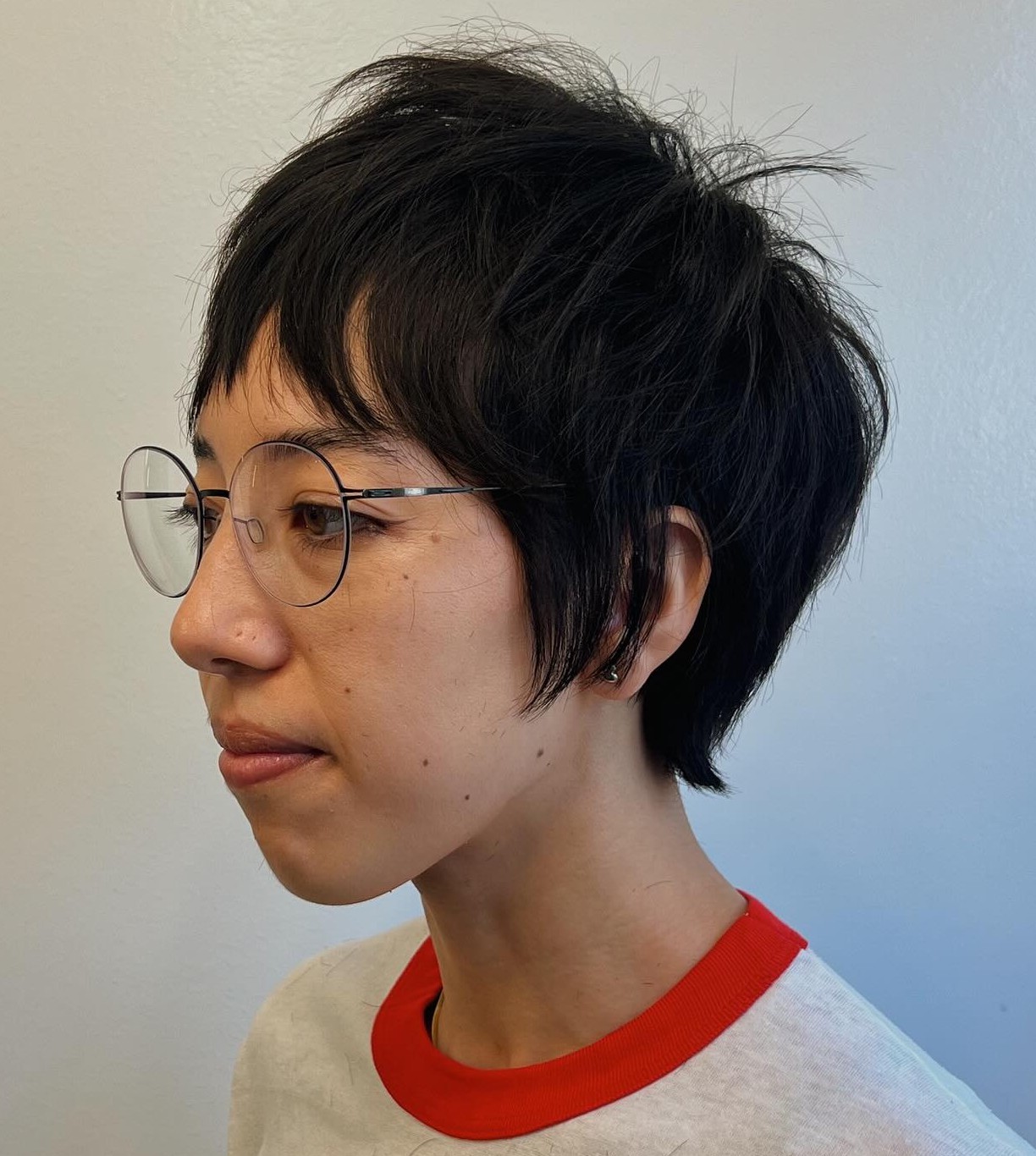 Choppy Razored Pixie Cut with Separated Strands and Visible Texture on Thick Dark Hair