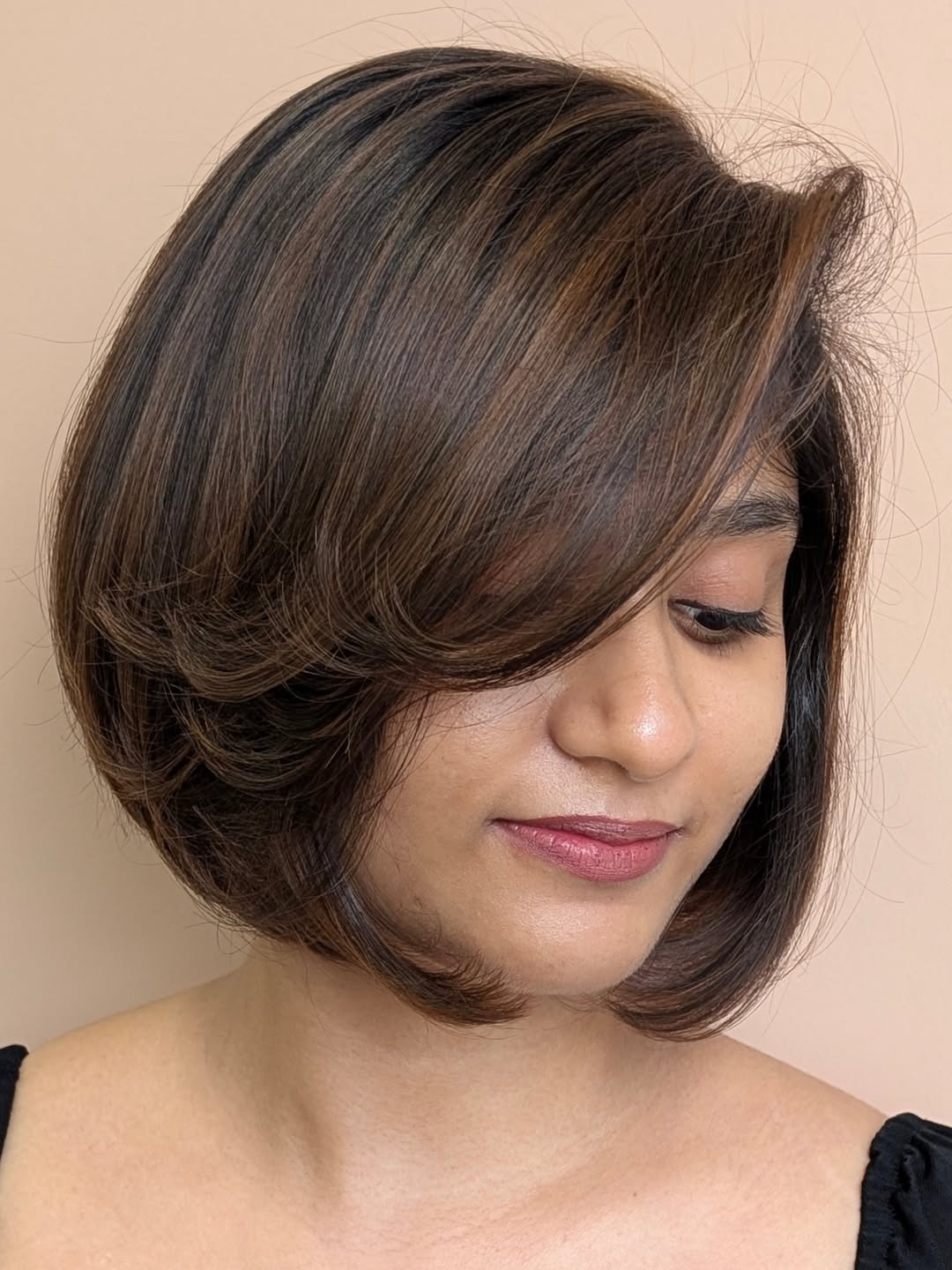 Voluminous Dark Brown Rounded Bob with Textured Layers and Deep Side Bangs