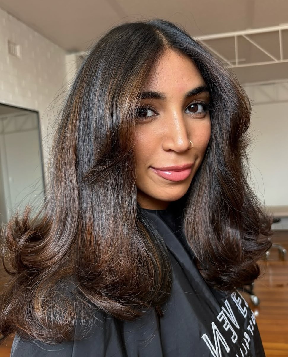 Medium-to-Long Brunette Butterfly Haircut with Bouncy Layers and Highlights