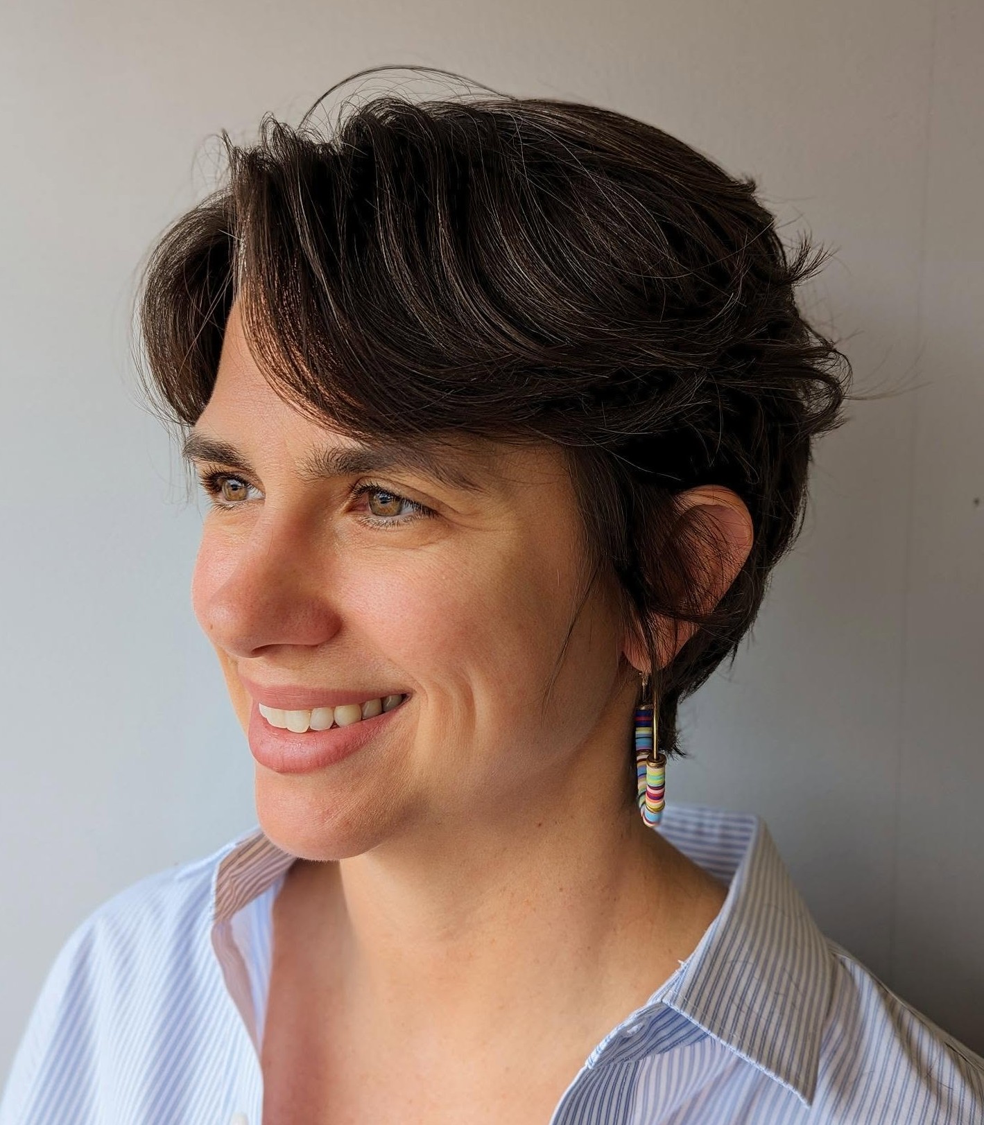 Choppy Textured Pixie with Razored Ends on Thick Dark Brown Hair Showing Separation and Movement