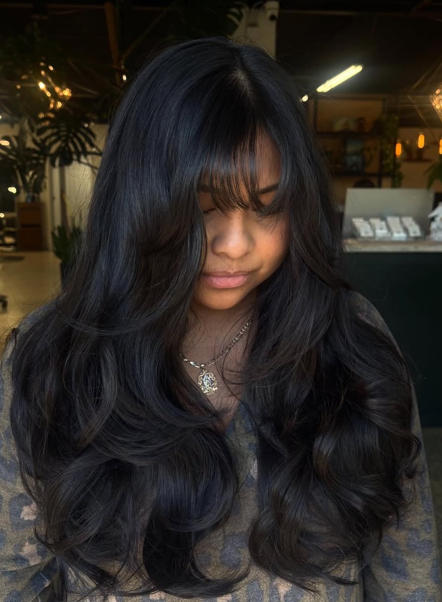 Long Thick Dark Hair with Cascading Waves and Wispy See-Through Bangs