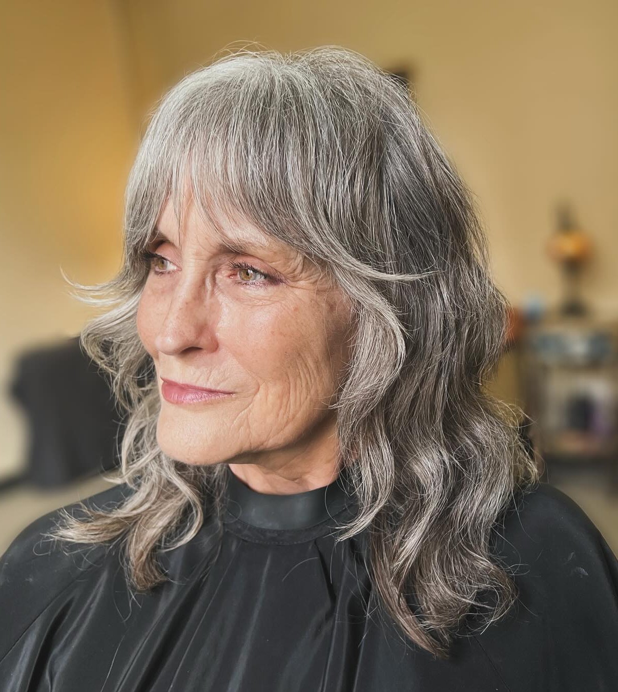Wavy Grey Shag Haircut with Curtain Bangs