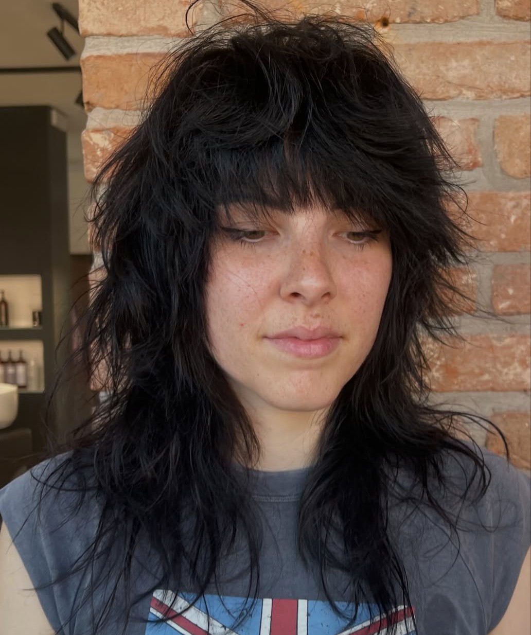 Edgy Black Medium Shag with Heavy Thick Bangs