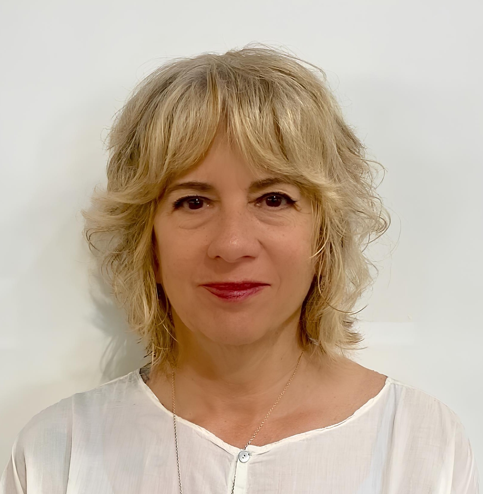 Shaggy Blonde Bob Haircut with Curtain Bangs