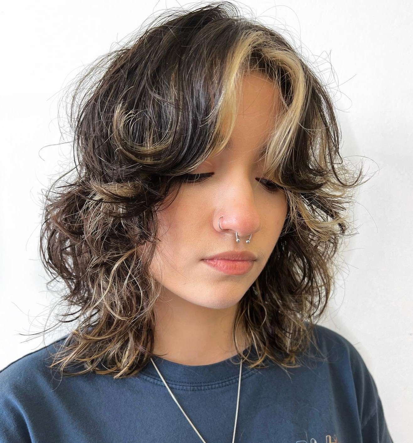 Shaggy Wolf Cut with Blonde Face-Framing Highlights