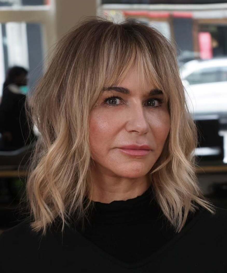 Wavy Blonde Bob Haircut with Curtain Bangs