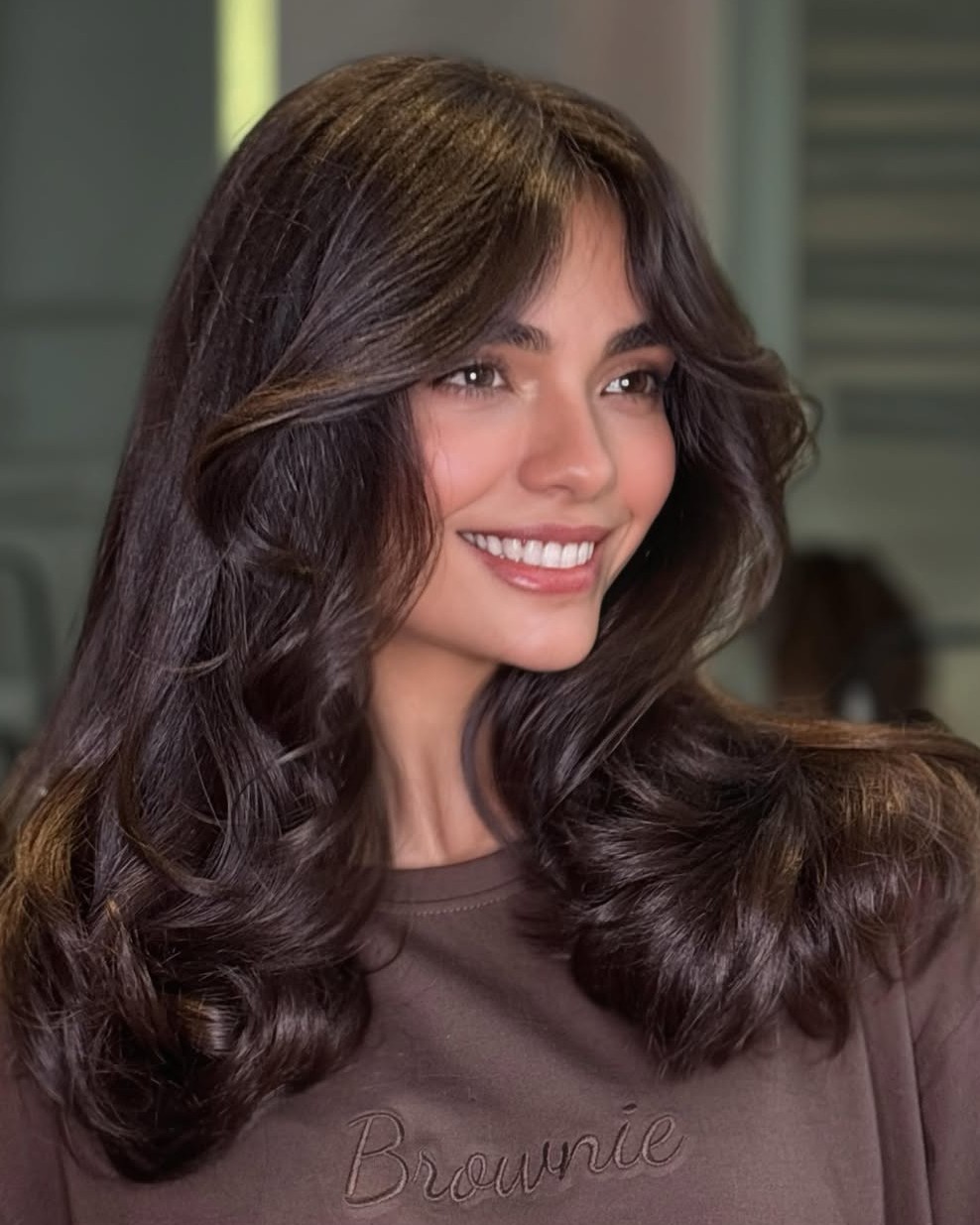 Bouncy 90s Style Chocolate Brown Blowout with Layered Face-Framing Framing