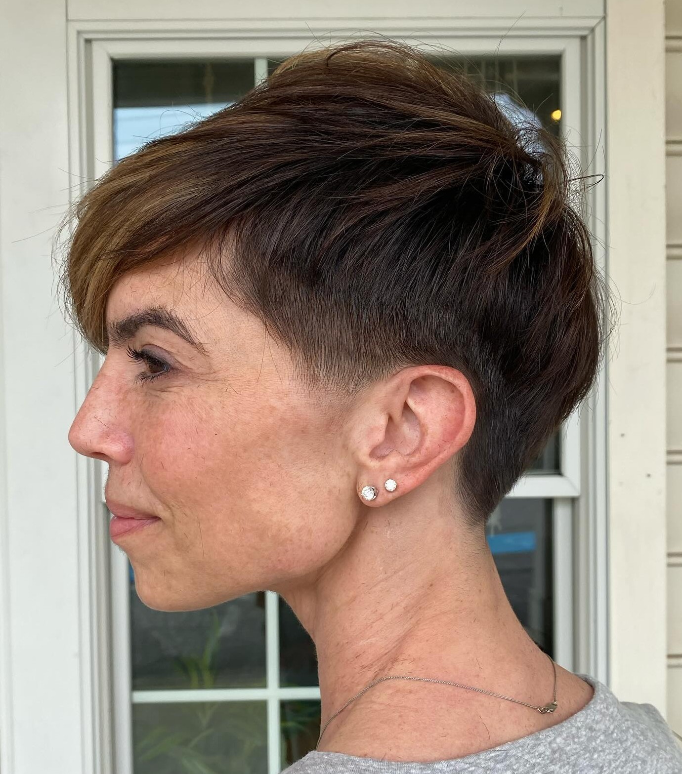 Edgy Textured Pixie with Undercut Sides and Layered Top on Dark Thick Hair