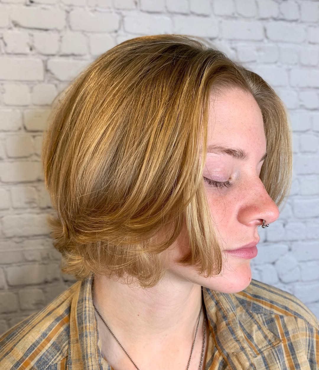 Chin-Length Golden Blonde Bob with Face-Framing Layers and Side Part