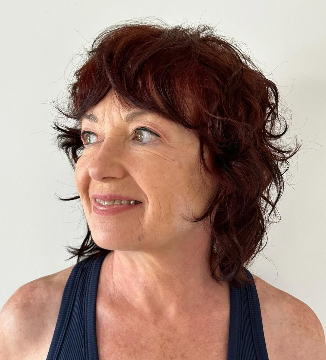 Shaggy Auburn Wolf Cut with Textured Layers and Fringe