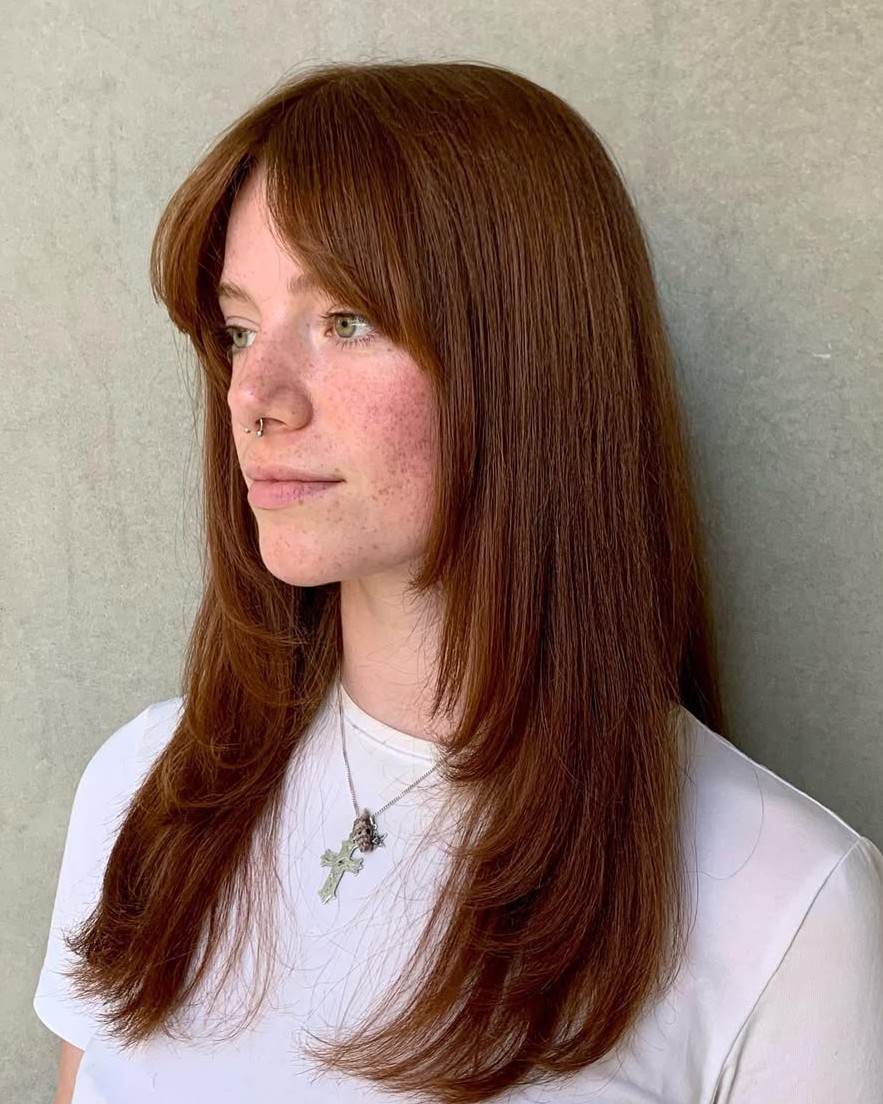 Straight Copper Red Hair with Sharp Layered Ends and Curtain Bangs
